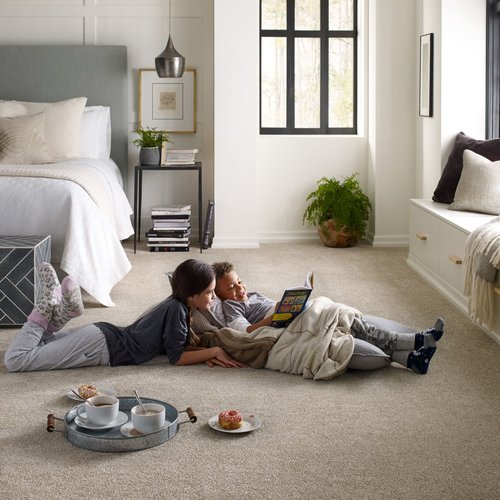 Kids reading on bedroom carpet from Carneys Carpet Gallery in Jeffersontown, KY